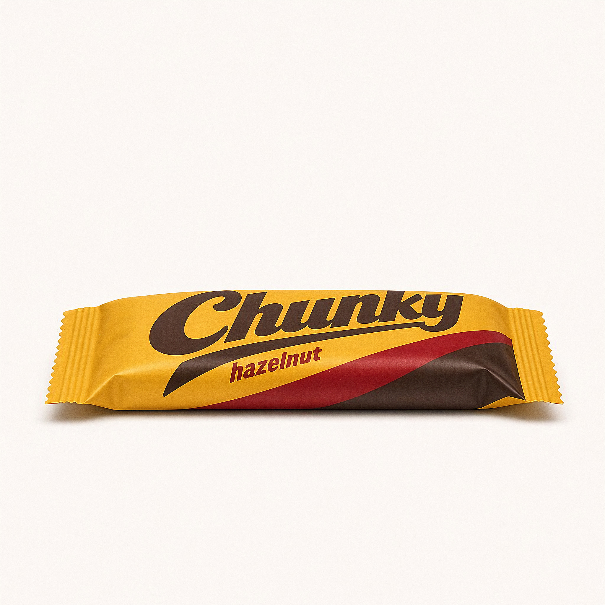 Side view of the Chunky hazelnut protein bar on white