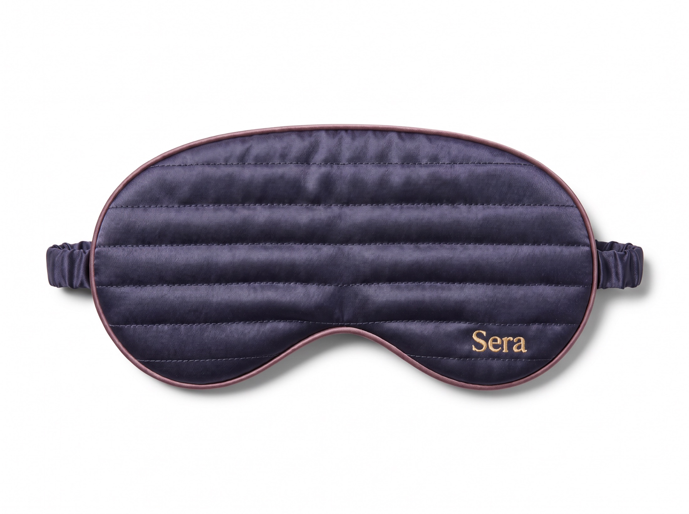 Front view of the Sera silk sleep mask, quilted channels and the gold wordmark, on white