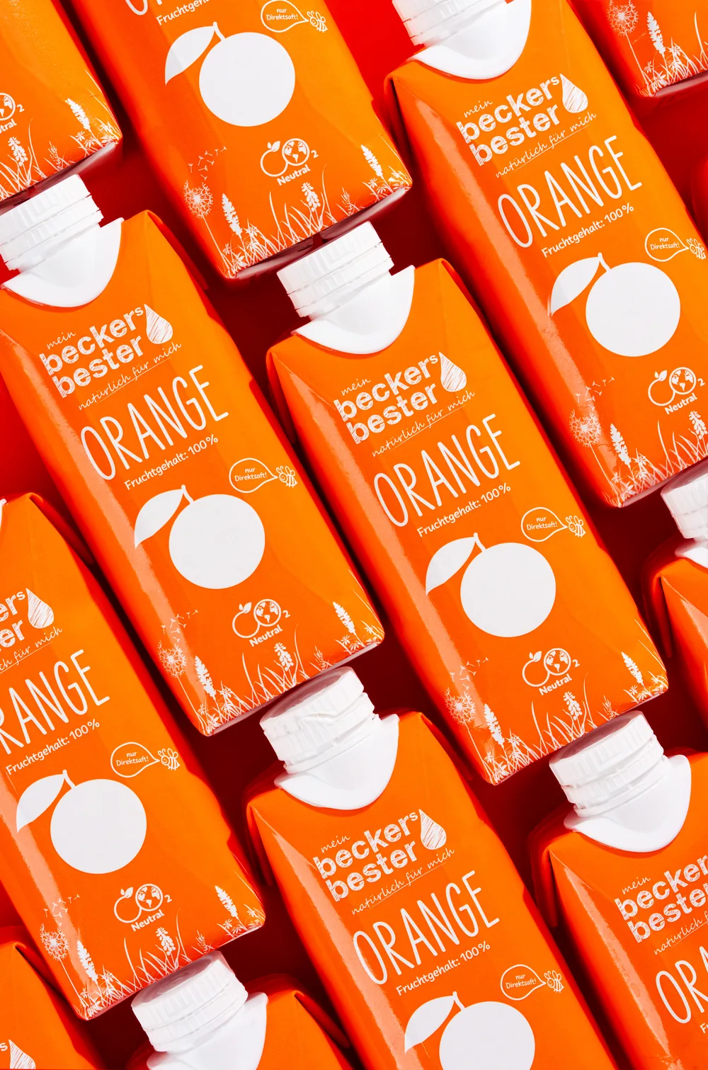 Repeating pattern of becker's bester orange juice cartons in bright orange.