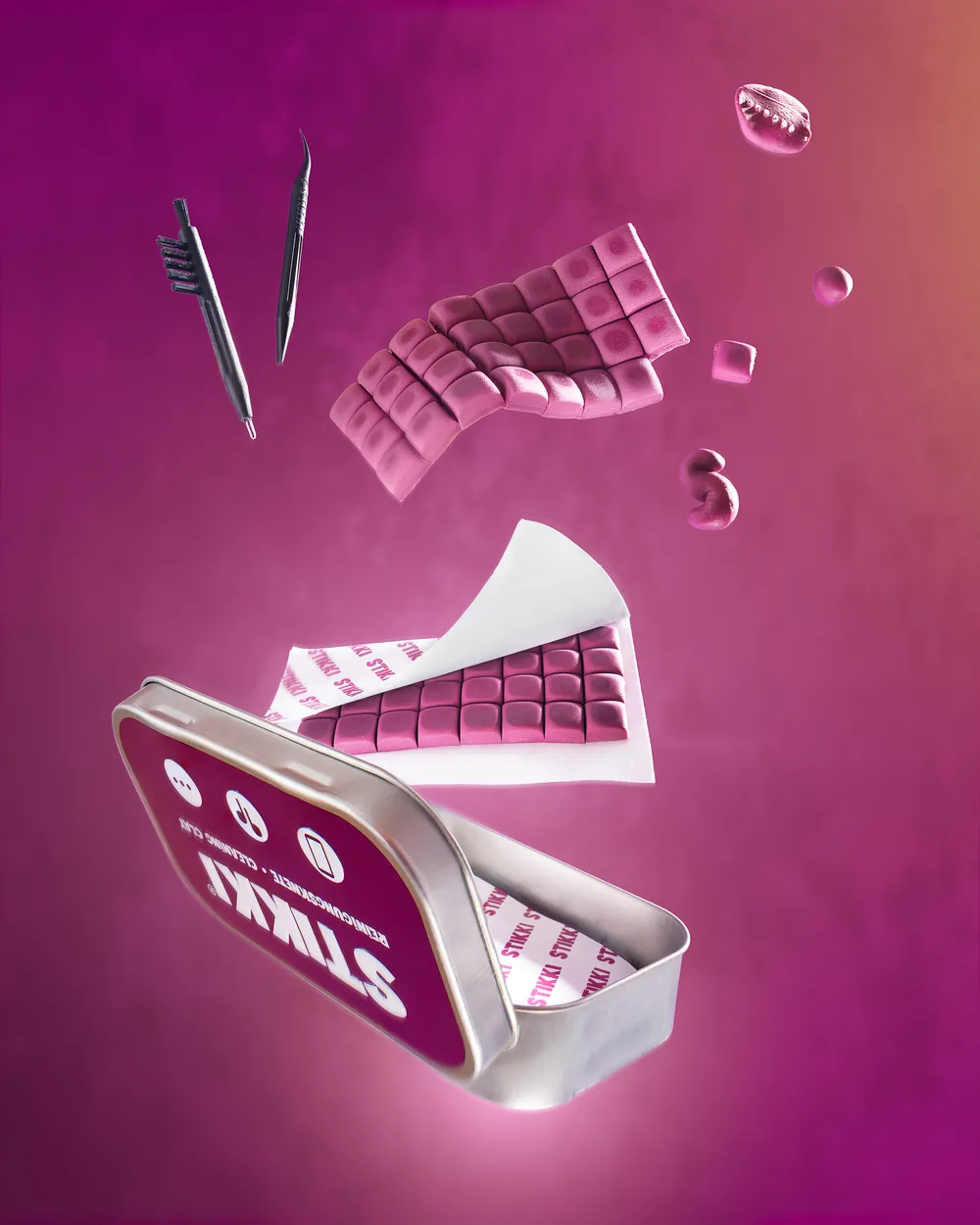 Stikki dental wax strips and case floating against a magenta background.
